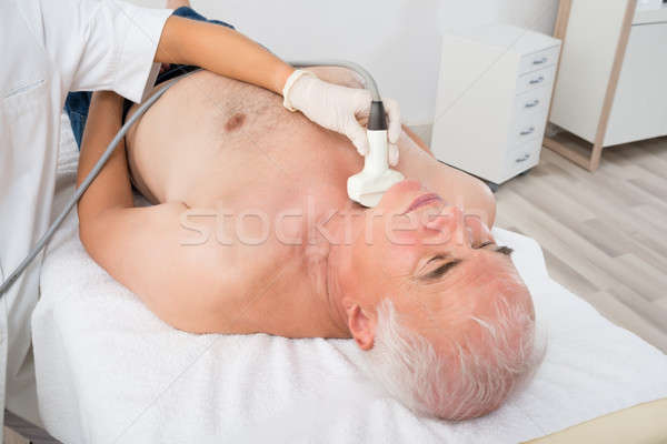 Stock photo: Man Getting Ultrasound Scan On Neck By Doctor