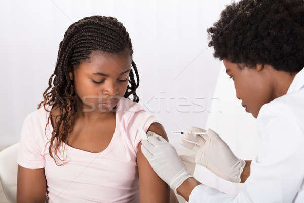 Doctor Applying Injection To Patient Stock photo © AndreyPopov