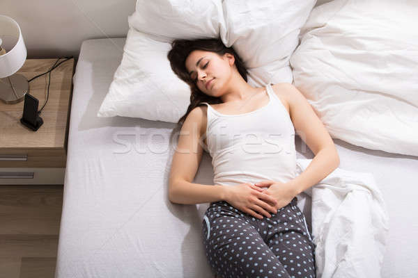 Woman With Stomach Pain Stock photo © AndreyPopov