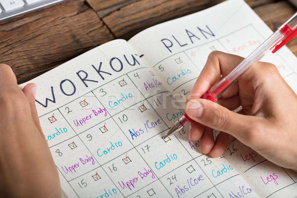 Human Hand Making Workout Plan Stock photo © AndreyPopov