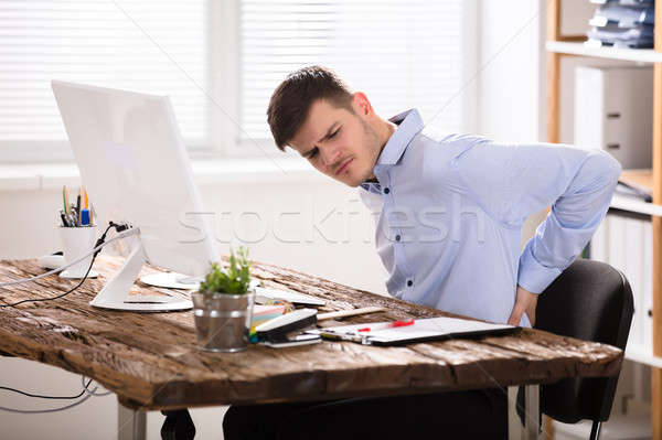 Young Businessman Having Back Pain Stock photo © AndreyPopov