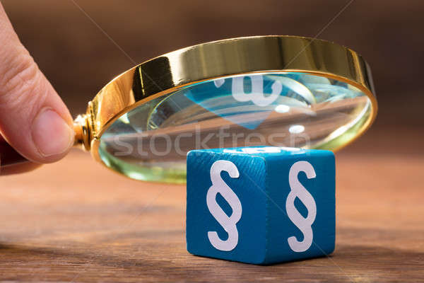 Person Examining The Blue Paragraph Block With Magnifying Glass Stock photo © AndreyPopov