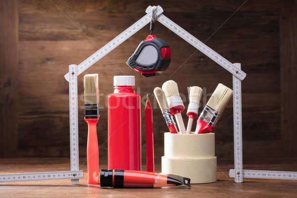 Painting Equipments Under The House Made With Measuring Tape Stock photo © AndreyPopov