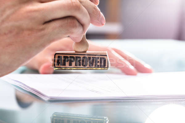 Businessman Stamping Approved On Document Stock photo © AndreyPopov