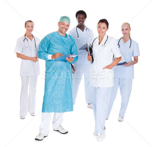Glücklich Arzt chirurgisch Kleid Mitarbeiter isoliert Stock foto © AndreyPopov