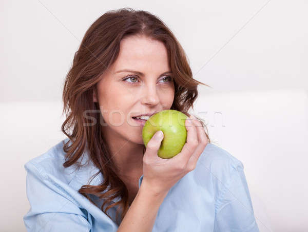 Woman eating a healthy green apple Stock photo © AndreyPopov
