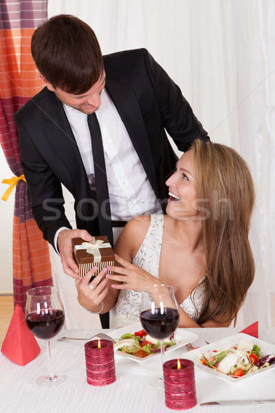 Człowiek zaskakujący żona dar przystojny młody człowiek Zdjęcia stock © AndreyPopov