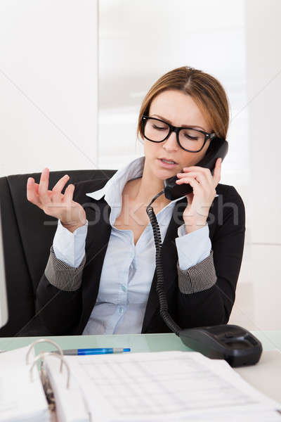 Businesswoman Talking On Telephone Stock photo © AndreyPopov