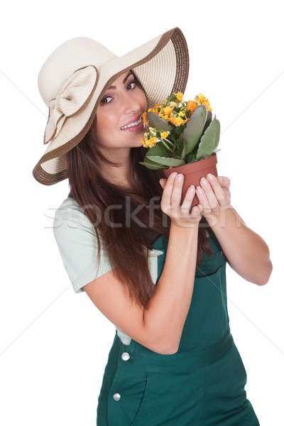 Pretty Woman Inhaling Fragrance Of Fresh Flower Stock photo © AndreyPopov
