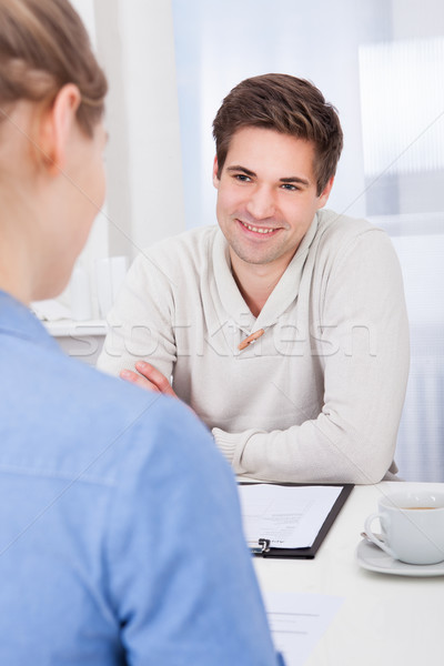 Businesspeople Talking At Workplace Stock photo © AndreyPopov