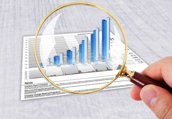 Hand Analyzing Bar Graph With Magnifying Glass Stock photo © AndreyPopov