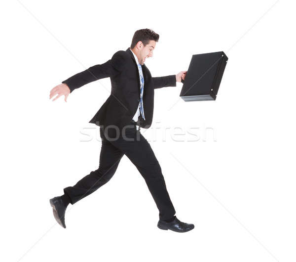 Businessman With Suitcase Running Over White Background Stock photo © AndreyPopov