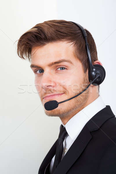 [[stock_photo]]: Centre · d'appel · représentant · casque · bureau · vue · de · côté