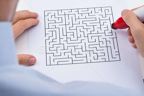 Person With Maze On Paper Stock photo © AndreyPopov