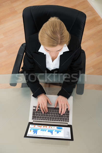 Businesswoman Working On Financial Data With Laptop Stock photo © AndreyPopov