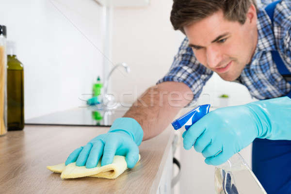 Arbeitnehmer Reinigung rag jungen insgesamt Küche Stock foto © AndreyPopov