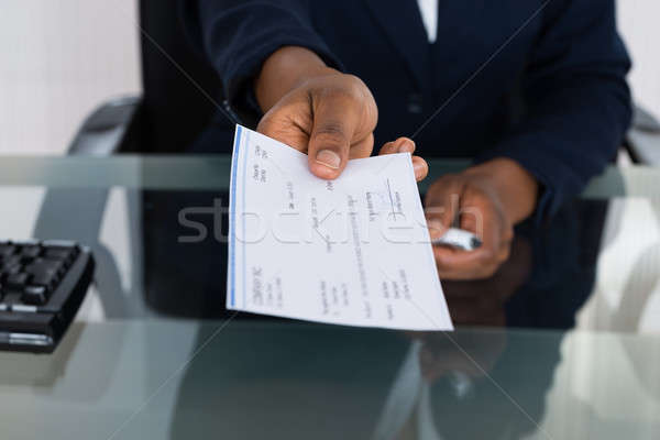 Person's Hand Giving Cheque Stock photo © AndreyPopov