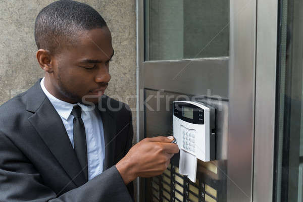 Businessman Entering Code In Security System Stock photo © AndreyPopov