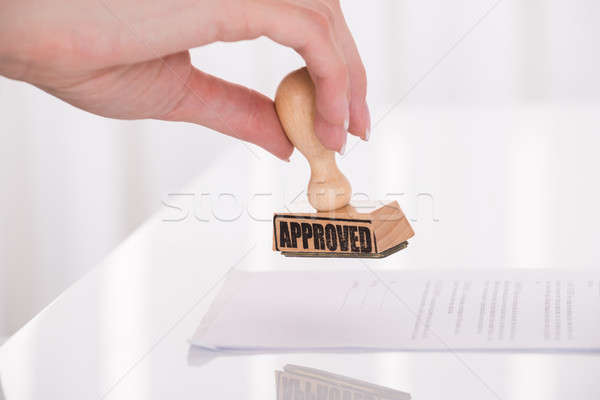 Person's Hand Stamping Approved On Contract Paper Stock photo © AndreyPopov