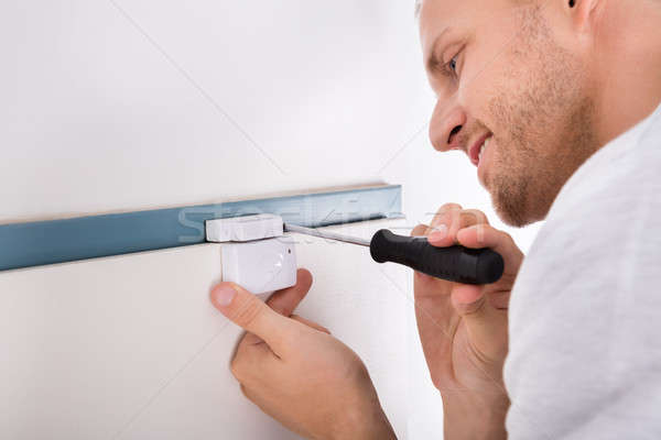 Man Installing Security System Door Sensor Stock photo © AndreyPopov