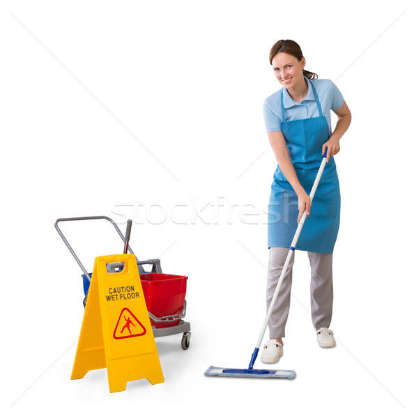 Homme concierge nettoyage étage jeunes femme Photo stock © AndreyPopov