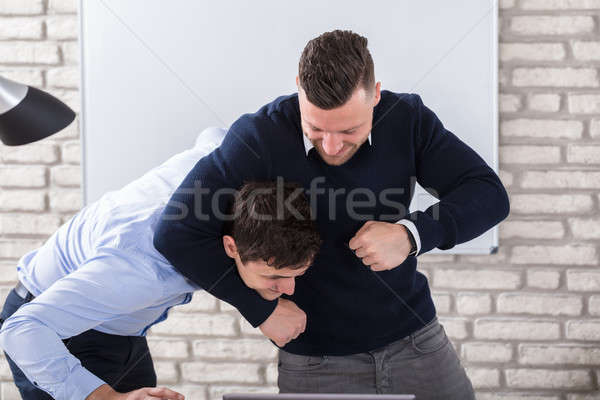 Two Colleague Fighting In Office Stock photo © AndreyPopov
