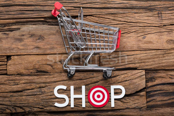 Shop Text With Dartboard On Wooden Table Stock photo © AndreyPopov