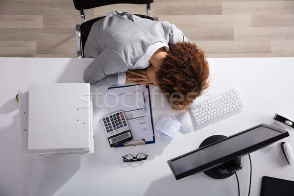 Stressed Businesswoman Sleeping In Office Stock photo © AndreyPopov