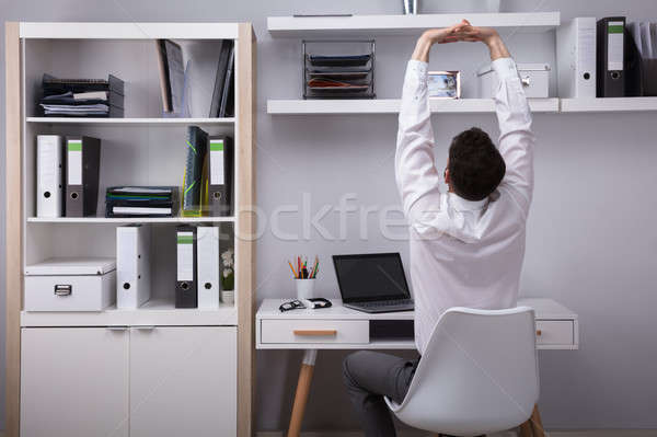 Businessman Stretching His Arms Stock photo © AndreyPopov