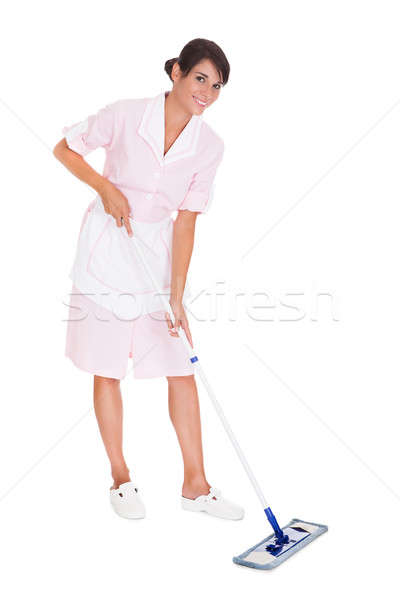 Młodych pokojówka czyszczenia piętrze szczęśliwy tle Zdjęcia stock © AndreyPopov
