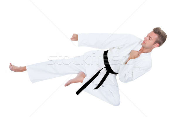 Jonge man oefenen karate kimono witte man Stockfoto © AndreyPopov