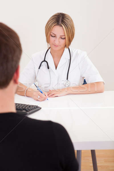 Arzt schriftlich nach unten Verschreibung krank Client Stock foto © AndreyPopov