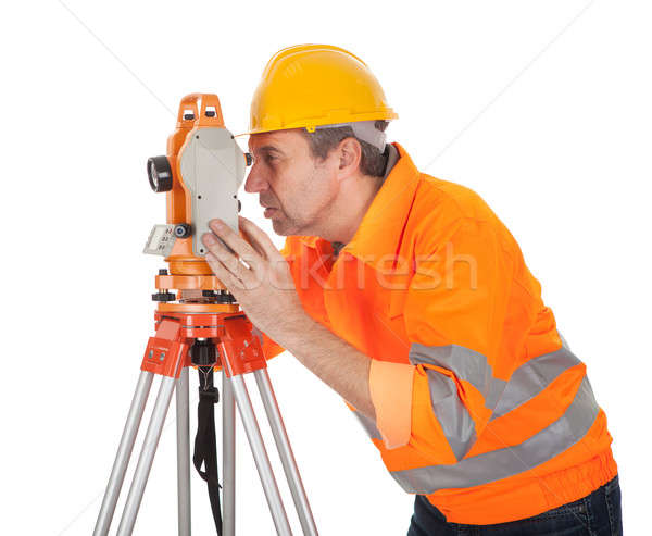 Senior land surveyor with theodolite Stock photo © AndreyPopov