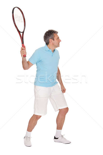 Homme mûr jouer tennis isolé blanche sport [[stock_photo]] © AndreyPopov