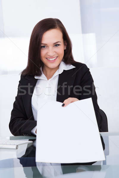 Businesswoman Giving Papers Stock photo © AndreyPopov