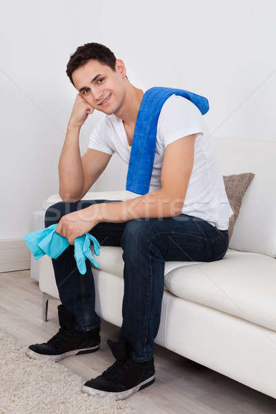 Man With Napkin And Gloves At Home Stock photo © AndreyPopov