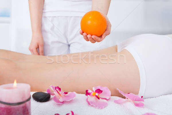 Massaggiatrice frutta arancione femminile donna fiore Foto d'archivio © AndreyPopov