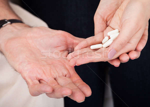 Hand halten weiß Pillen Arzt Stock foto © AndreyPopov