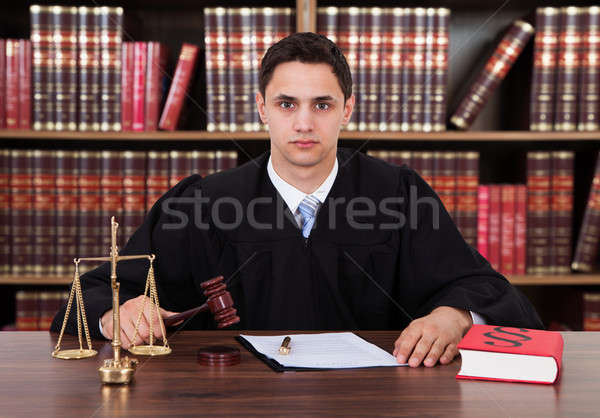 Portré fiatal bíró kalapács asztal férfi Stock fotó © AndreyPopov