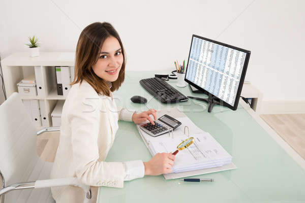 Businesswoman Checking Invoice With Magnifying Glass Stock photo © AndreyPopov
