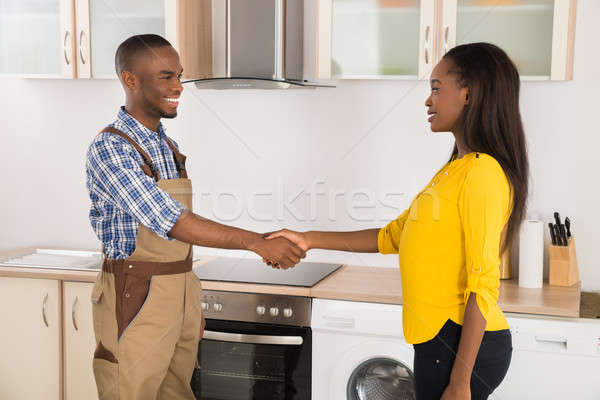 Serviceman And Woman Handshaking Stock photo © AndreyPopov