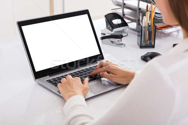 Businesswoman Working On Laptop Stock photo © AndreyPopov