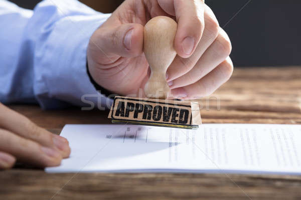 üzletember elismert bélyeg irat közelkép kéz Stock fotó © AndreyPopov