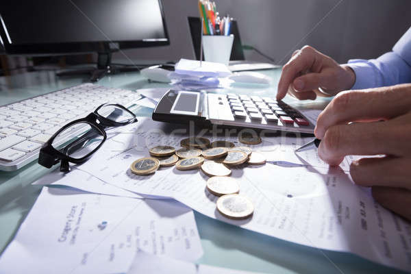 Paragon Kalkulator strony monet okulary Zdjęcia stock © AndreyPopov