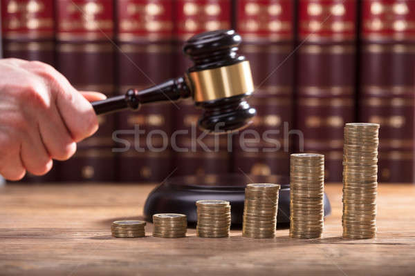 Close-up Of A Judge's Hand Holding Gavel Stock photo © AndreyPopov