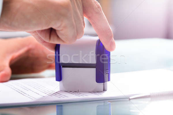 Businessman Stamping Approved On Document Stock photo © AndreyPopov