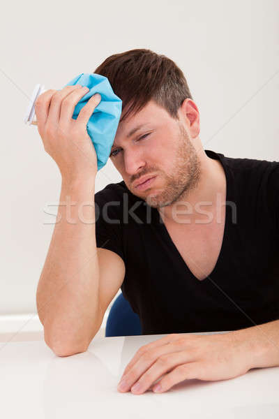 Sober guy got headache Stock photo © AndreyPopov