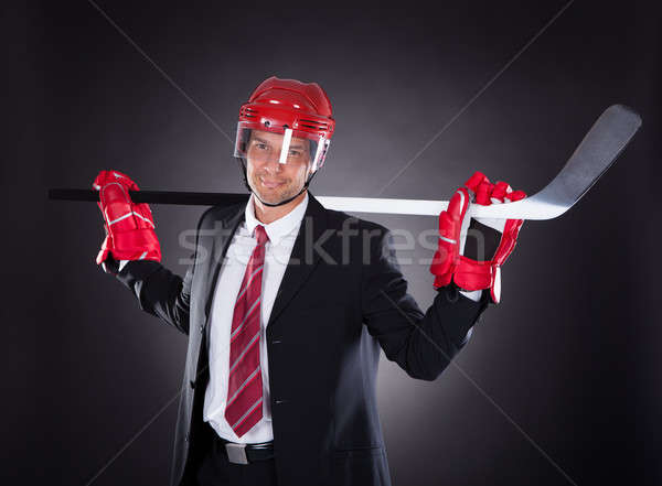 Businessman Dressed As Hockey Player Stock photo © AndreyPopov