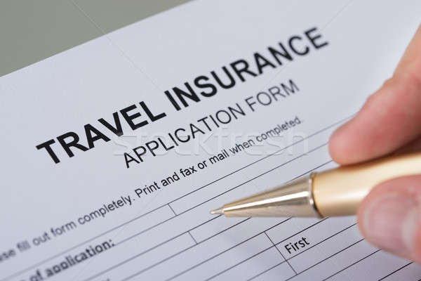 Hand Filling Travel Insurance Form Stock photo © AndreyPopov