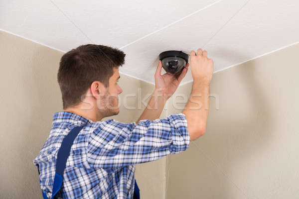 Technician Installing Surveillance Camera Stock photo © AndreyPopov
